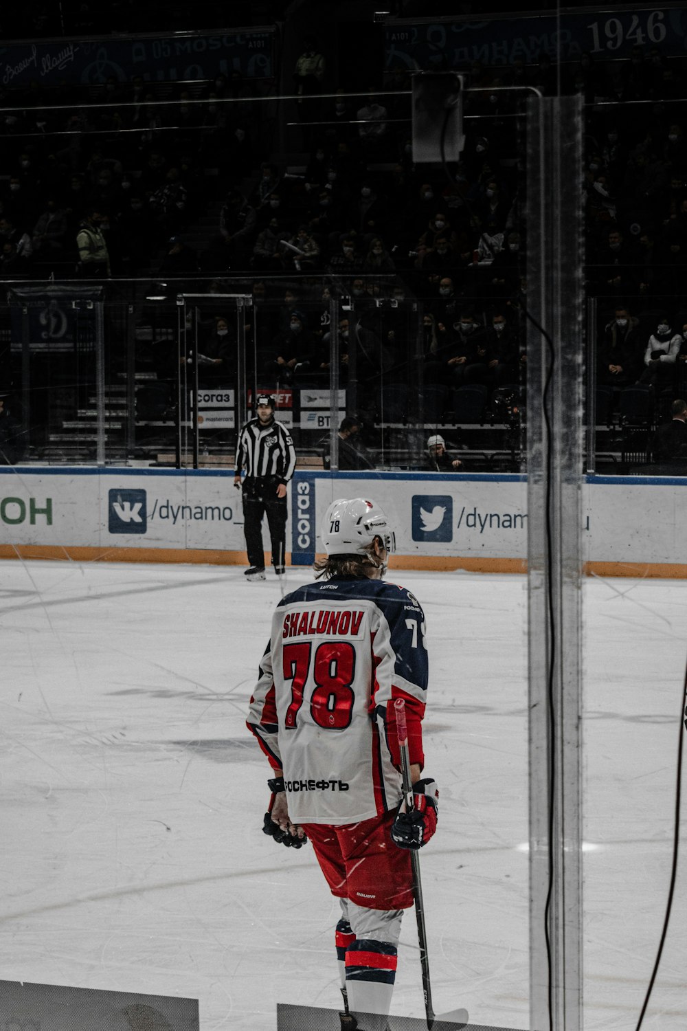 a hockey player is standing on the ice