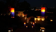 Evening view of the hotel courtyard with lanterns casting warm glows on stone walls.