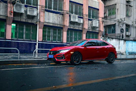 a red car parked on the side of the road