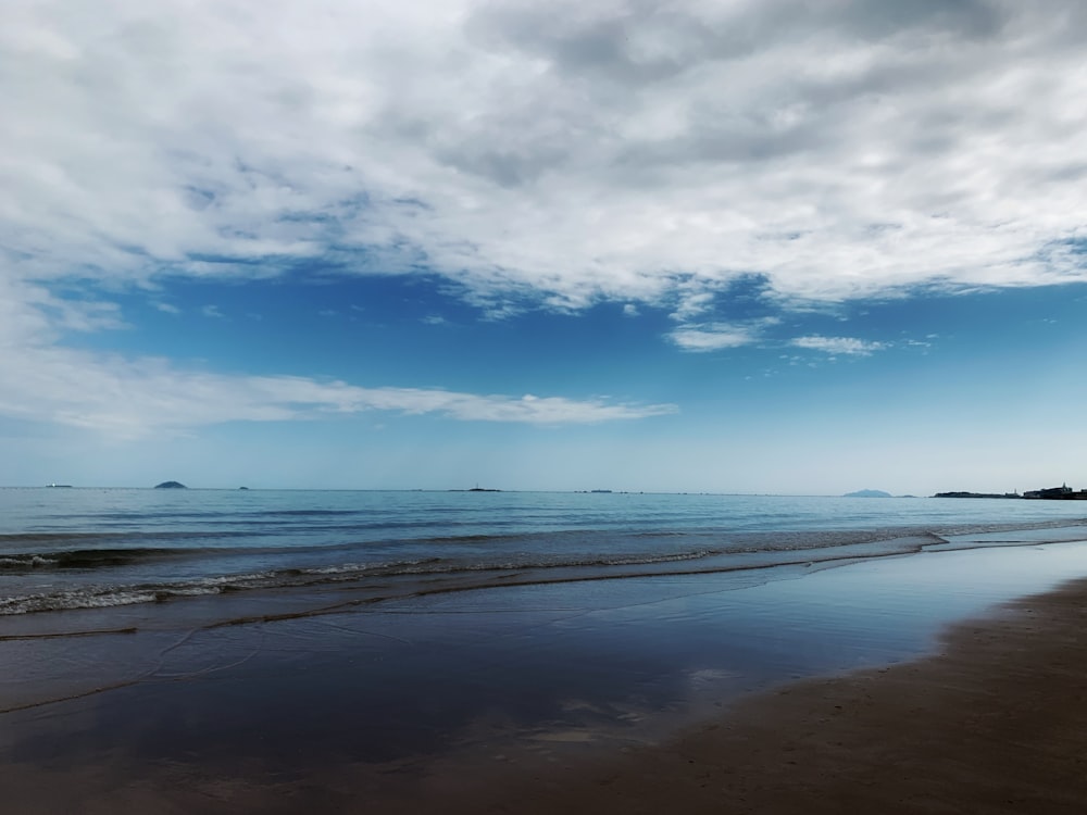 blue sky and white clouds over sea