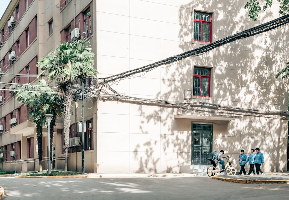 a group of people riding bikes down a street