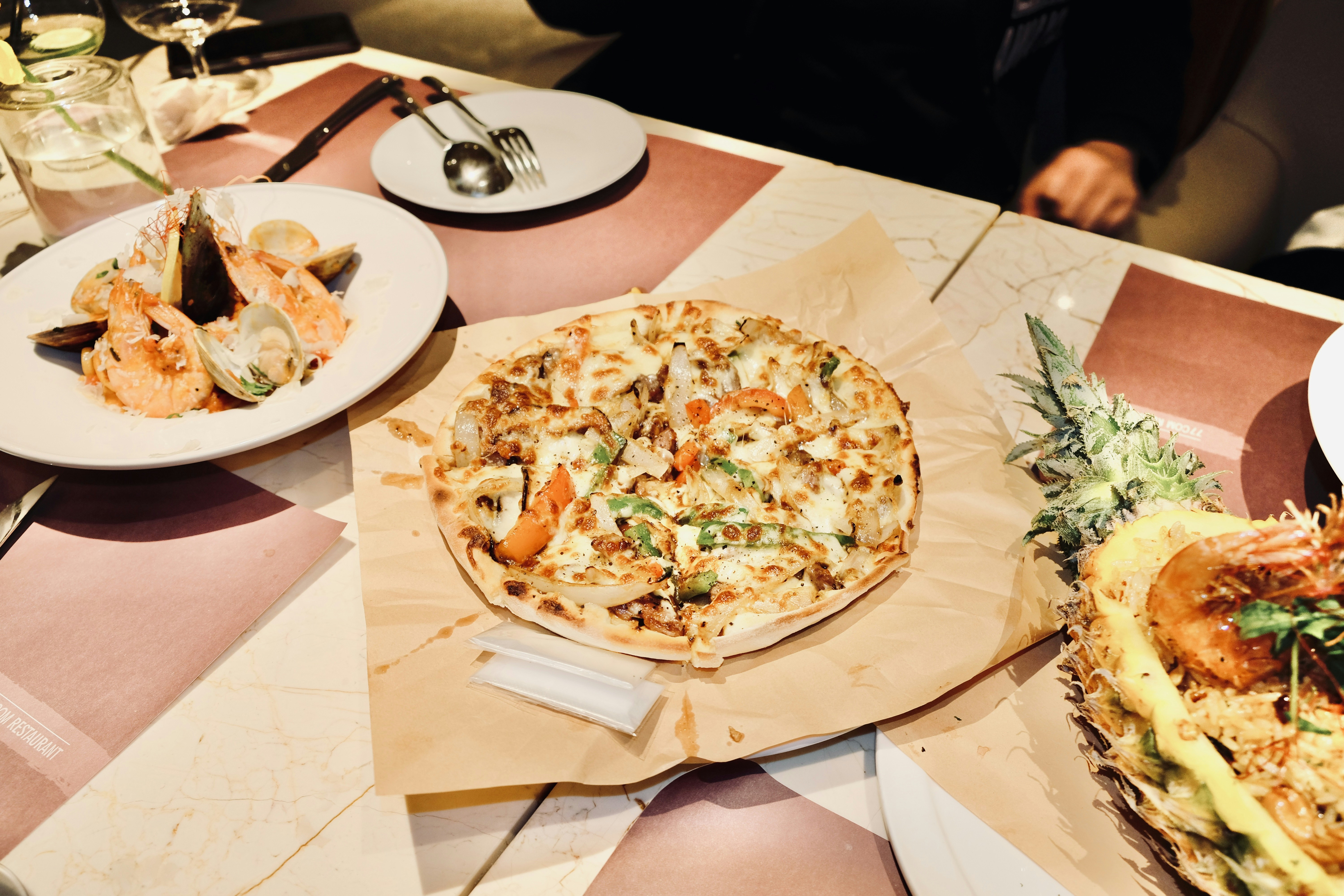 Signature dishes from top Uptown restaurants including Peking duck, banh mi, Ethiopian injera, and deep dish pizza - chicago uptown restaurants