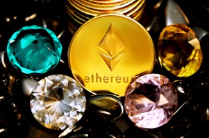 a close up of a gold coin surrounded by other jewels