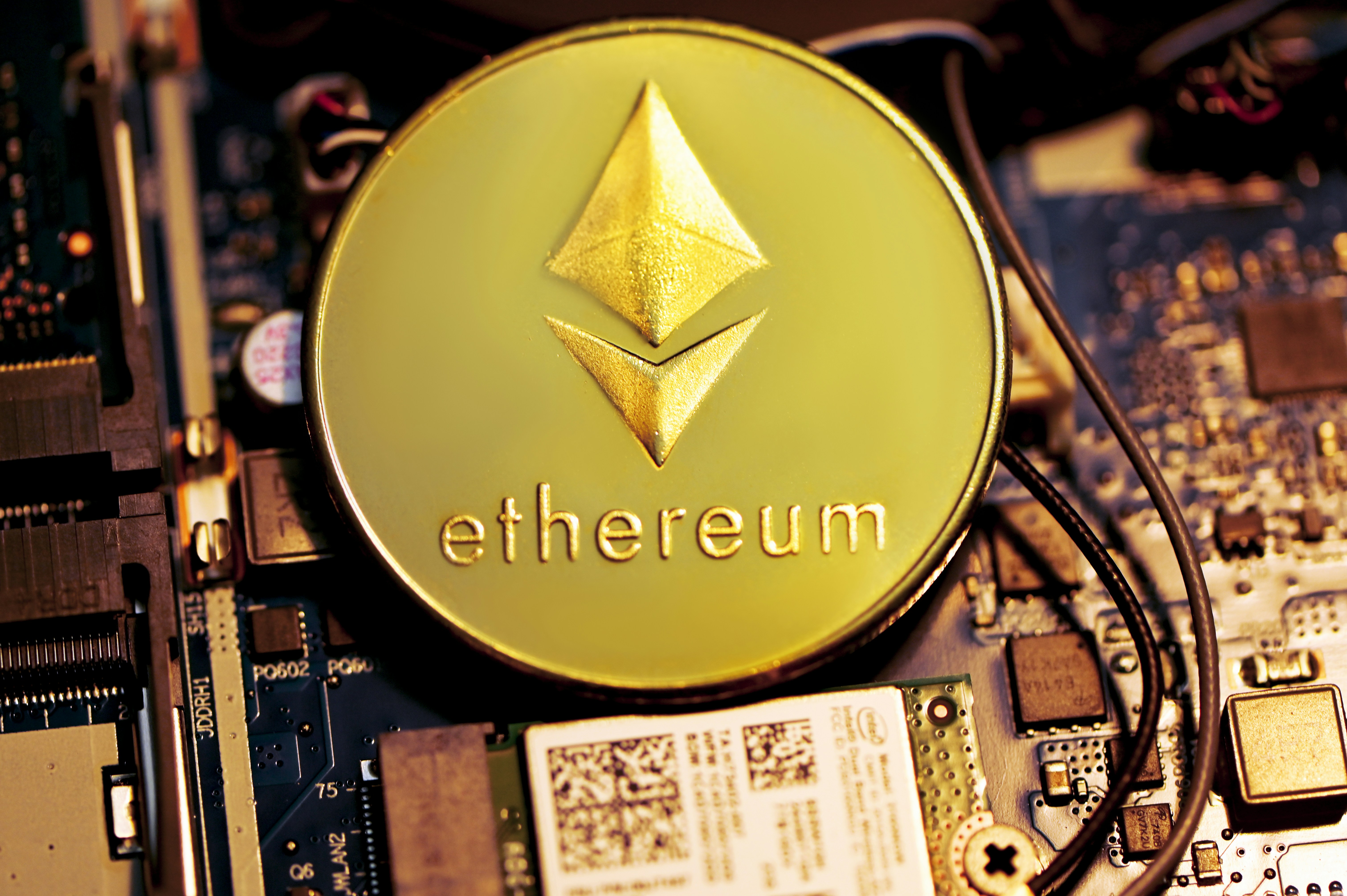 An Ethereum coin placed on a computer mainboard