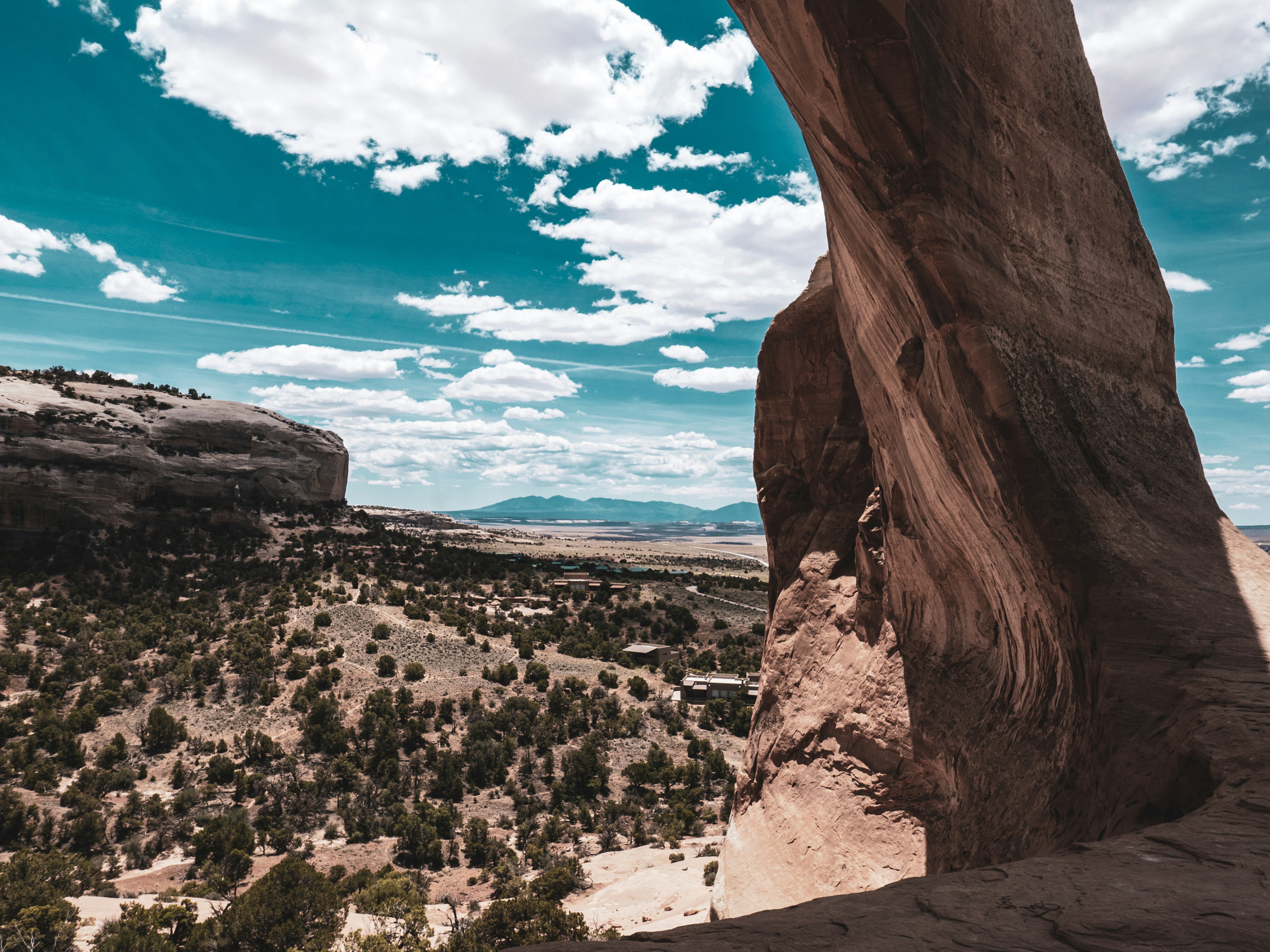 a person standing on top of a large rock