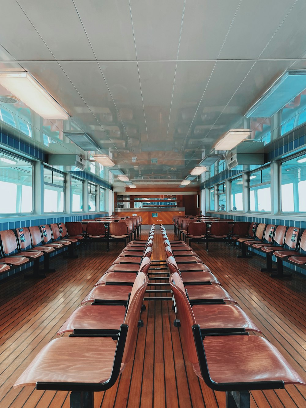 a row of seats sitting on top of a wooden floor