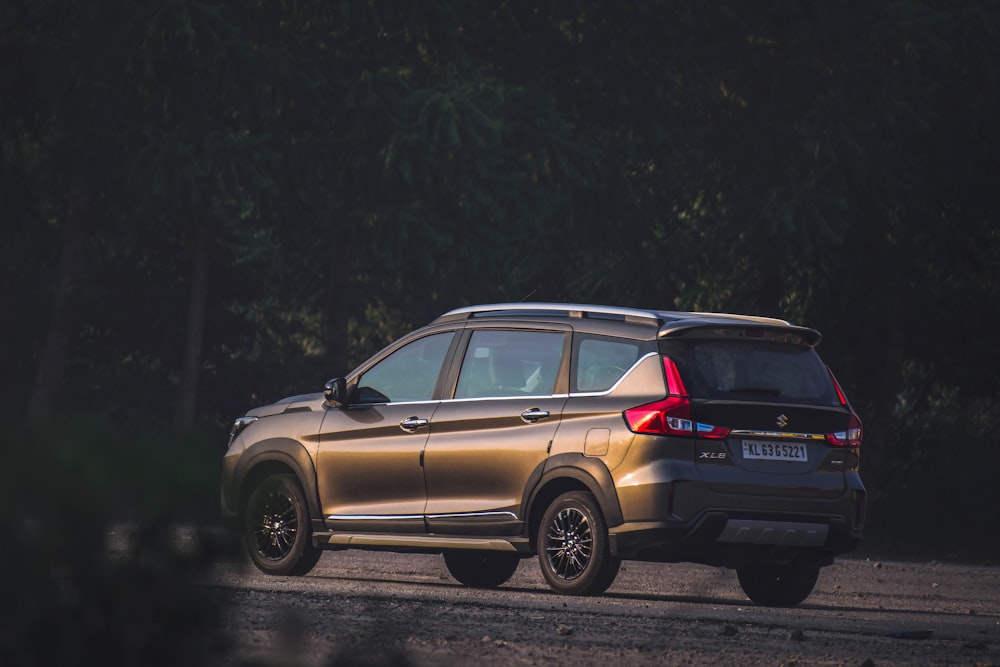 silver suv on road during daytime