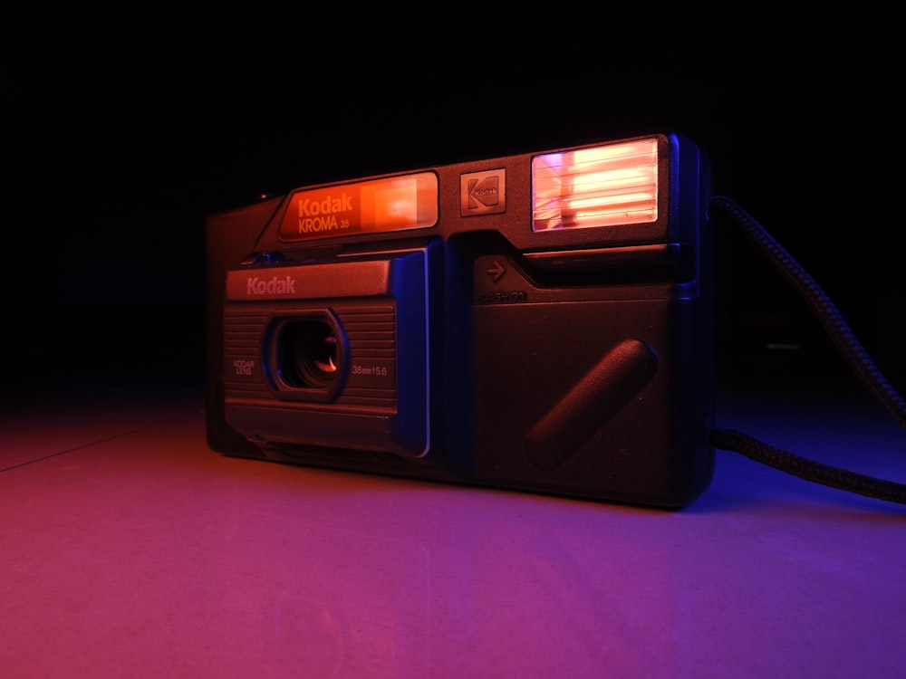 an old camera with a flash light on it