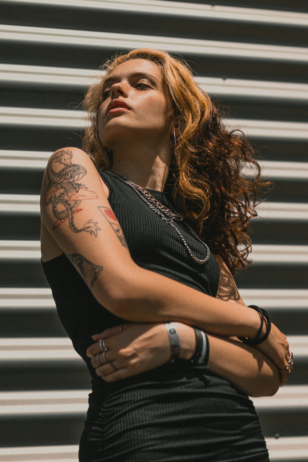 a woman with a tattoo on her arm