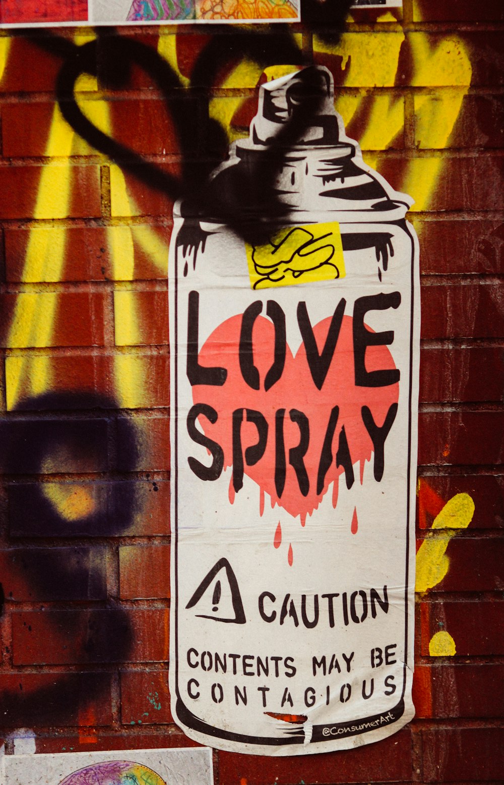 graffiti on a brick wall that says love spray