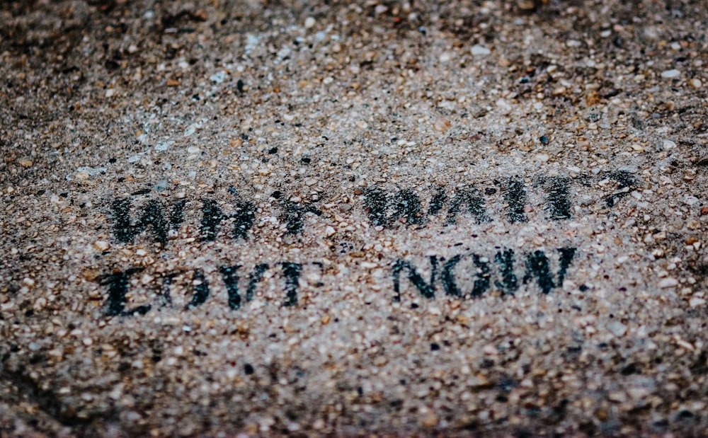 a close up of a sidewalk with writing on it