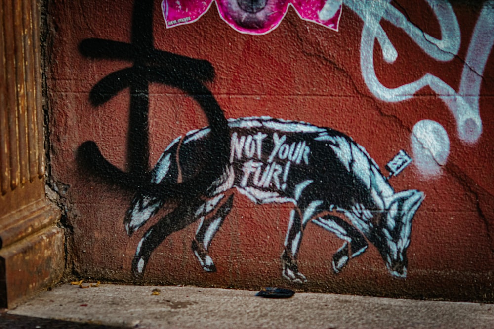 a pig painted on the side of a building