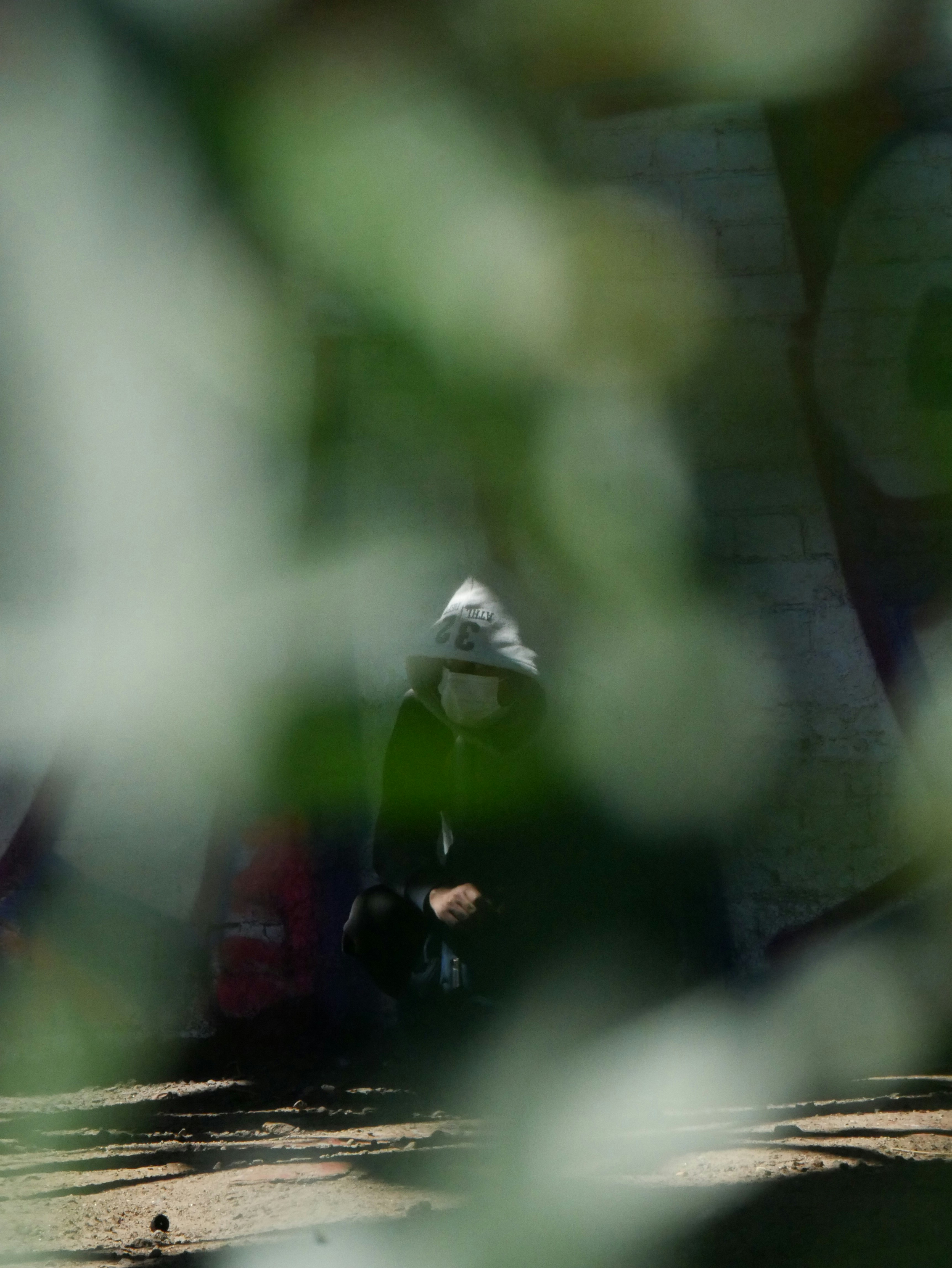 a blurry photo of a person sitting on a bench