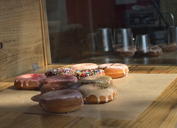 A beautifully arranged display of donuts on a wooden table.