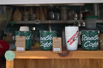 a display of coffee cups on a table