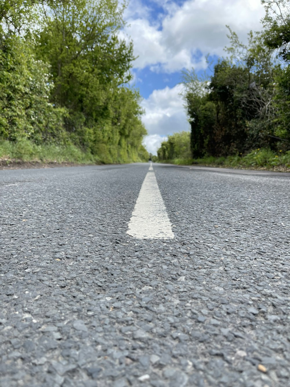 an empty street with a white line on it