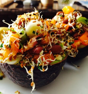 A vibrant salad with mixed greens, cherry tomatoes, avocado slices, and a light vinaigrette.
