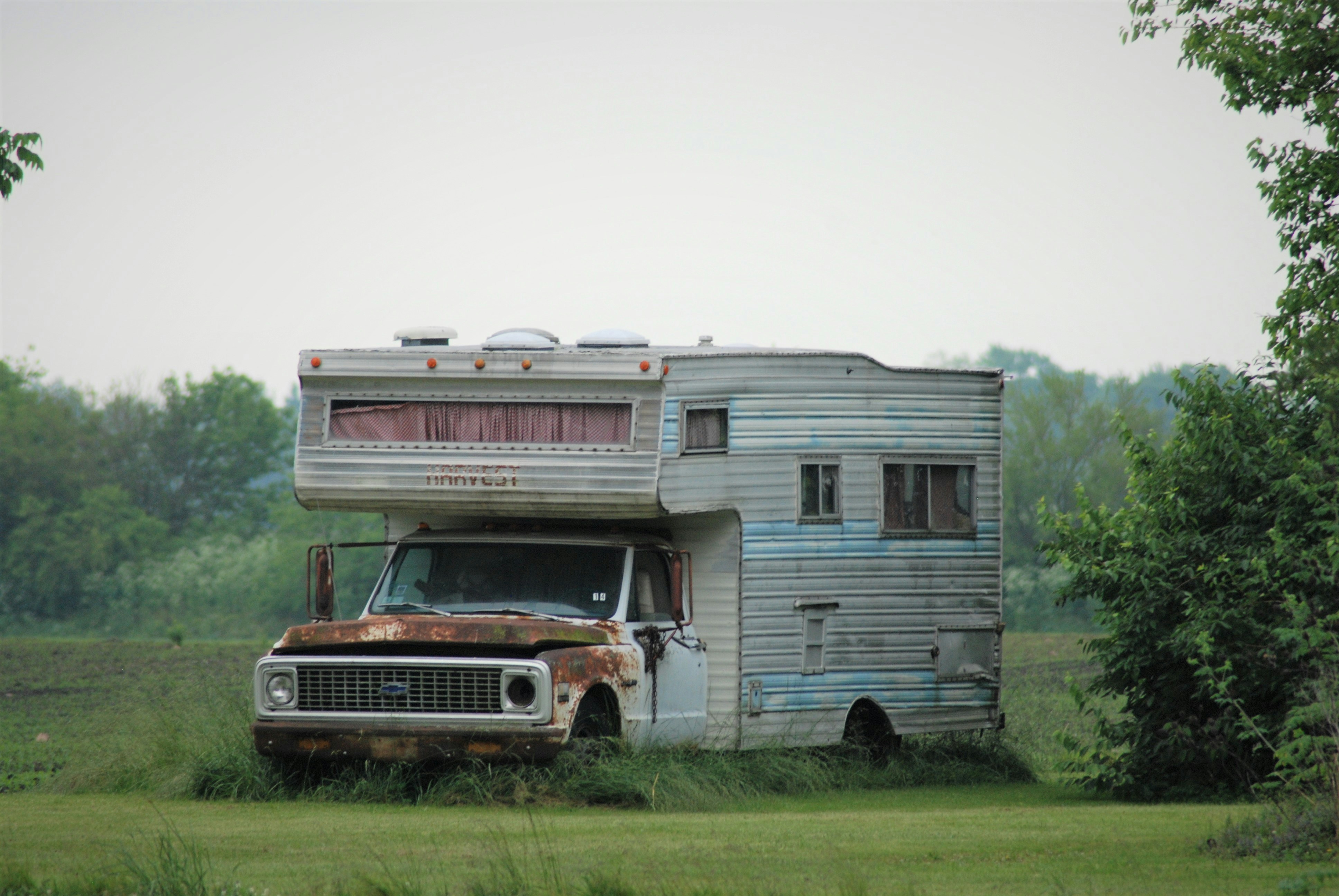 Old dead Chevrolet Mini Motorhome long past its prime