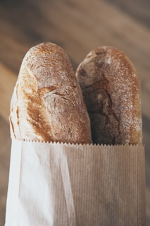 Close-up of Ajab baking flour bag with a rustic kitchen background