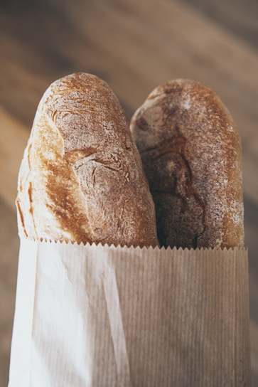 Close-up of Ajab baking flour bag with a rustic kitchen background