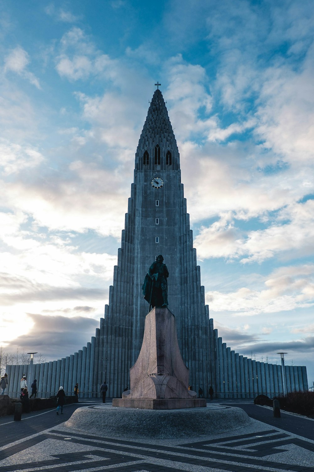 a very tall building with a clock on it's side