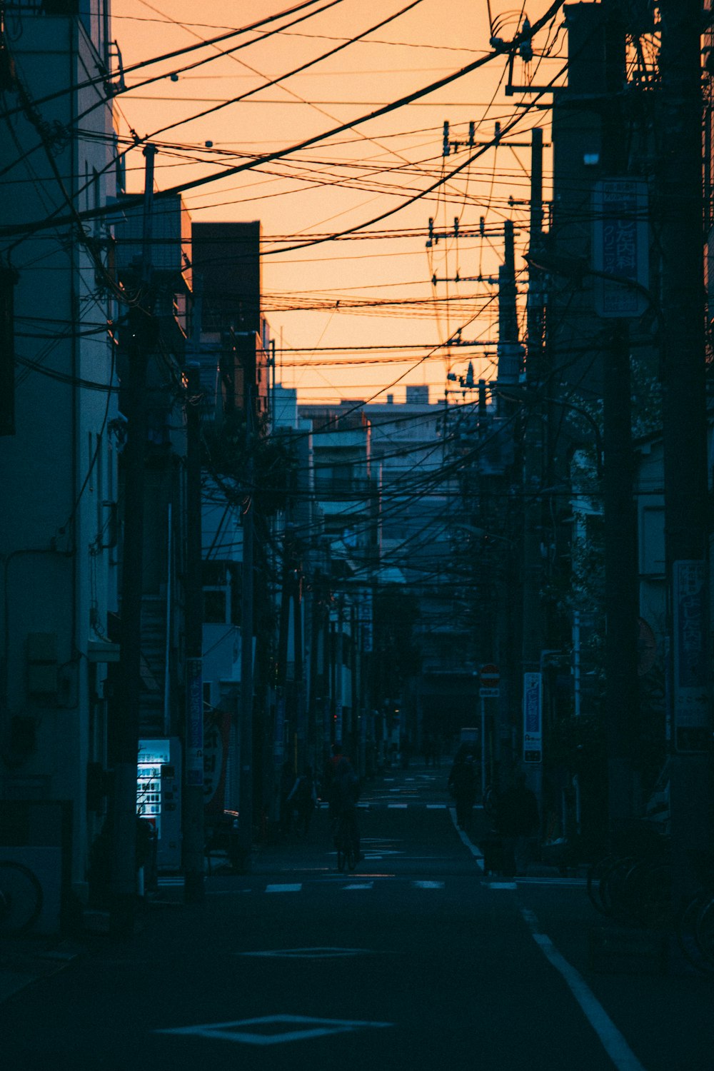 a city street with power lines above it