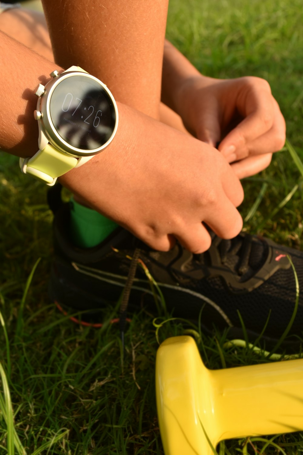 a close up of a person wearing a watch on their wrist