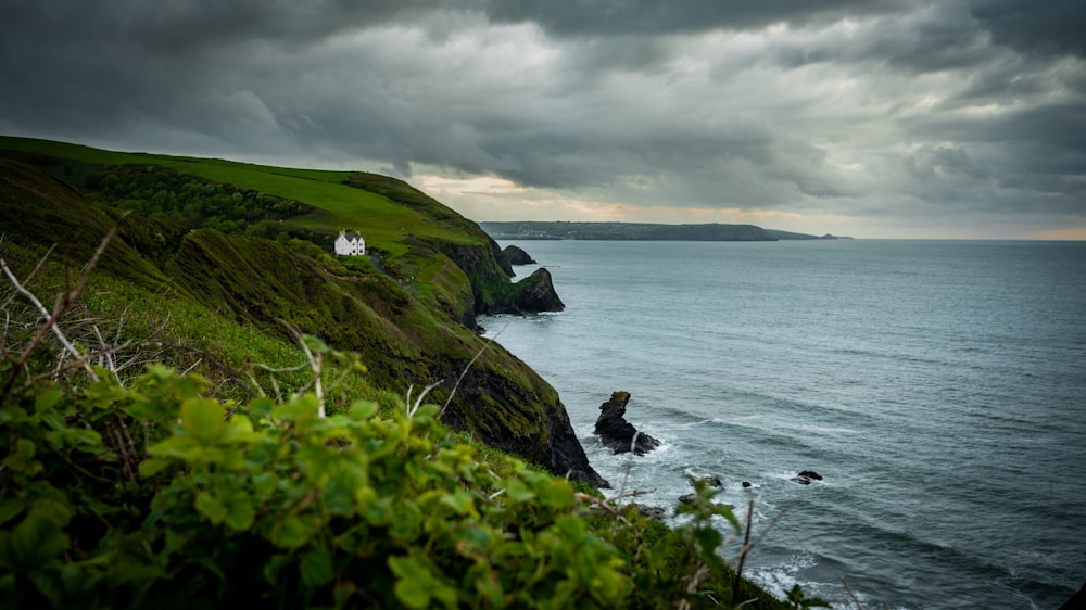 a house on a cliff overlooking the ocean