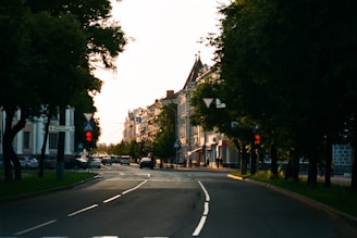 a city street with a red traffic light