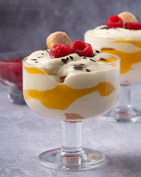 two desserts with raspberries on top of each other