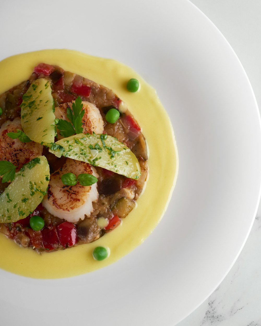 a white plate topped with a dish of food