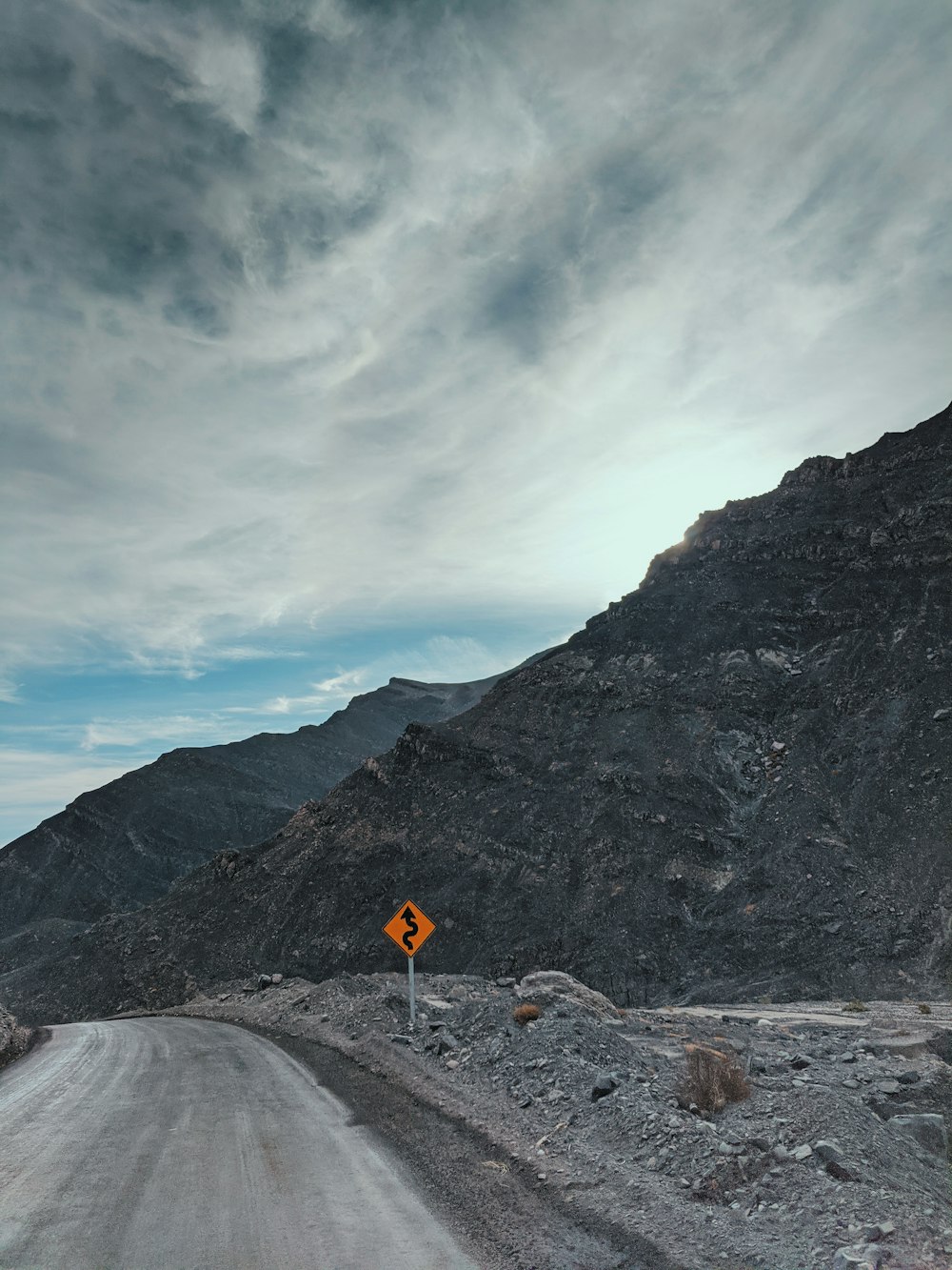 a road with a sign on the side of it