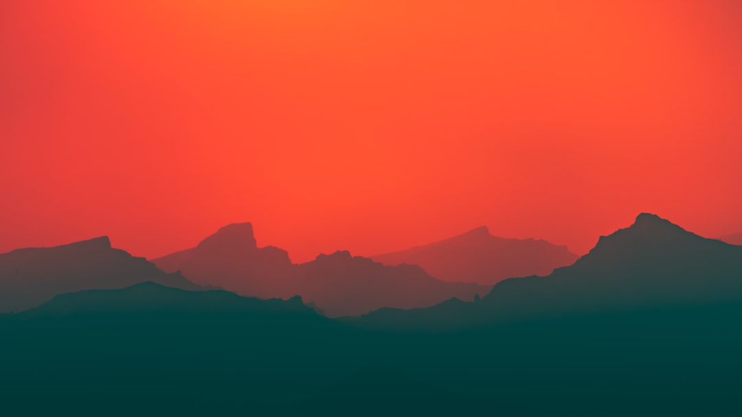 the sun is setting over the mountains in the distance, Colors!