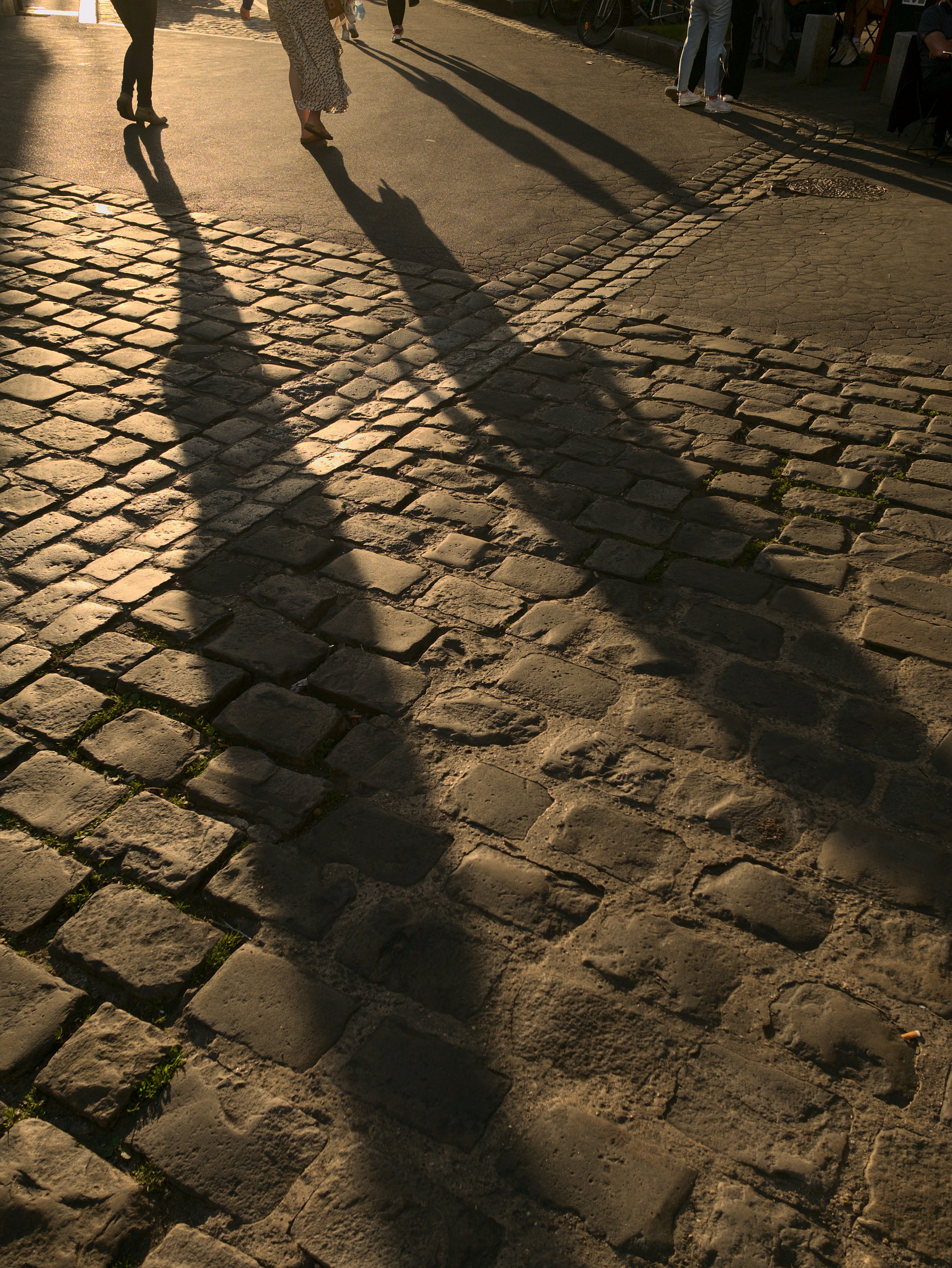 a group of people walking down a street