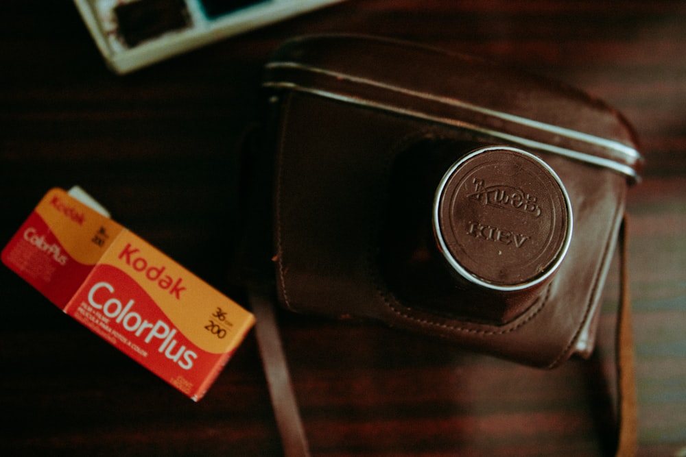 a camera and a couple of cigarettes on a table