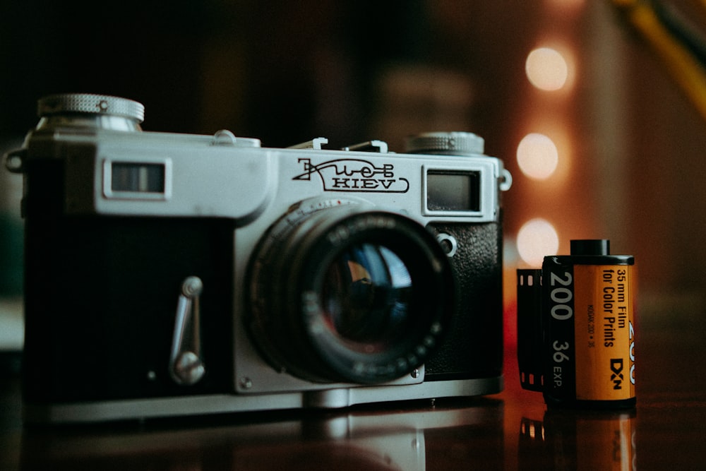 a camera and a battery sitting on a table