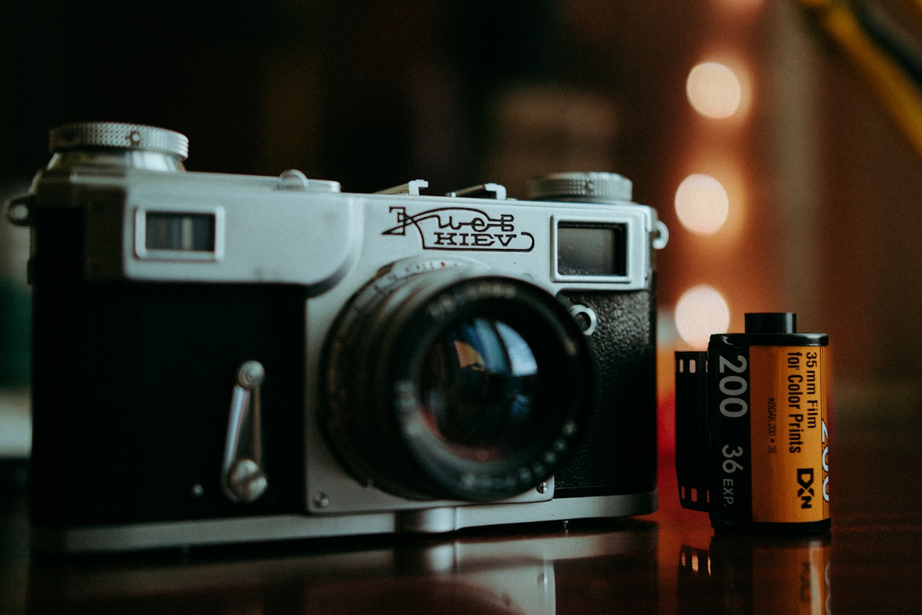 Vintage film camera as a photography prop on a styled surface