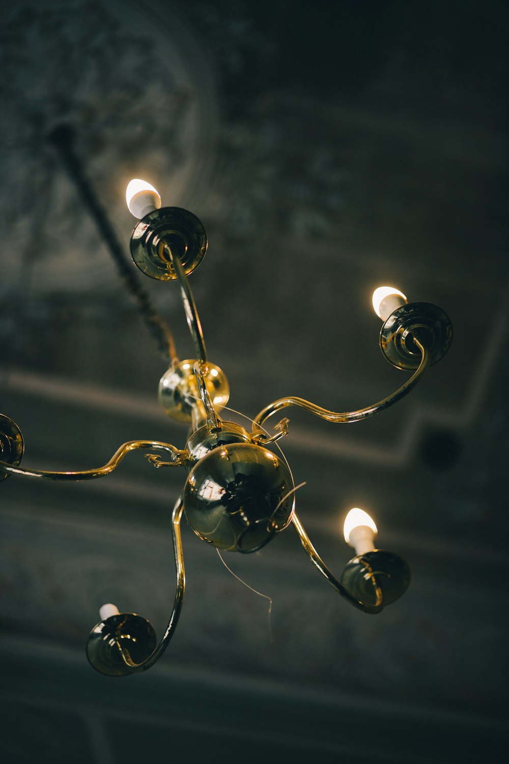 a chandelier hanging from a ceiling in a room