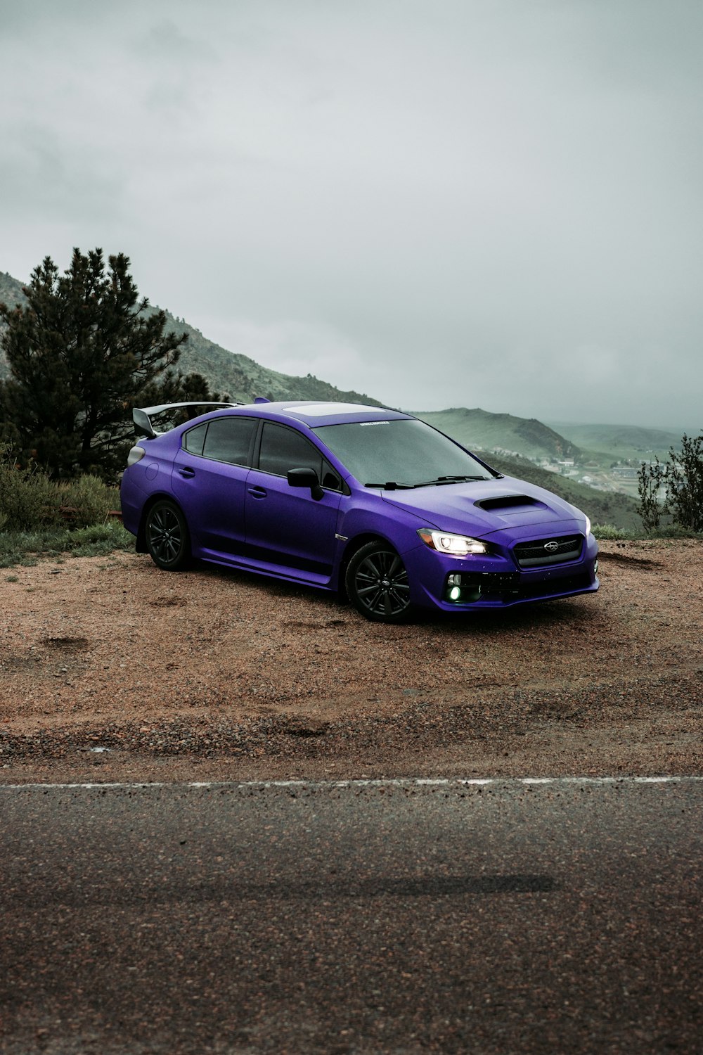 purple honda car on road during daytime