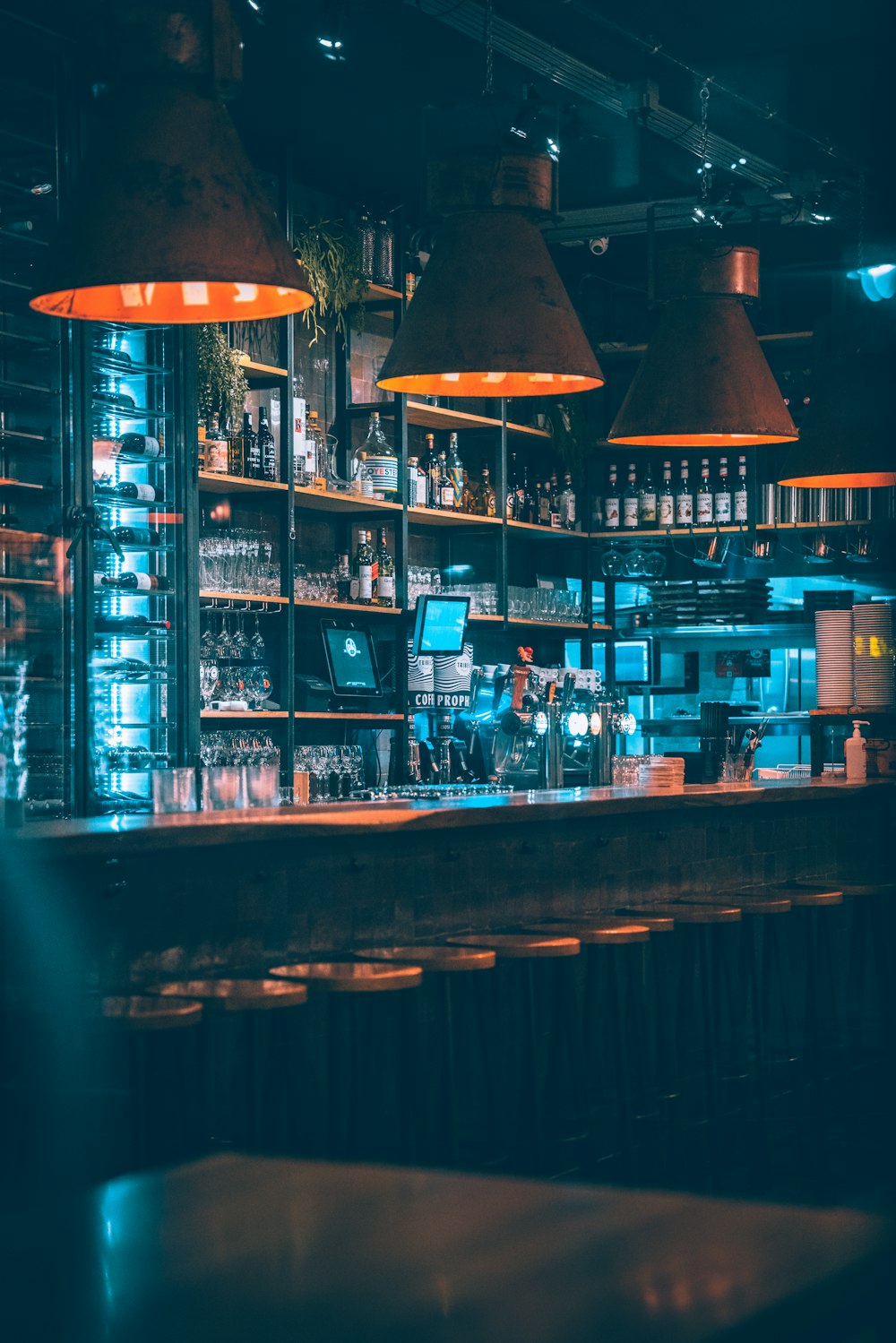 brown wooden shelf with bottles