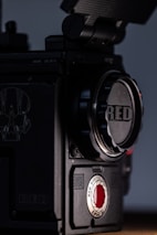 black and gray camera with red light