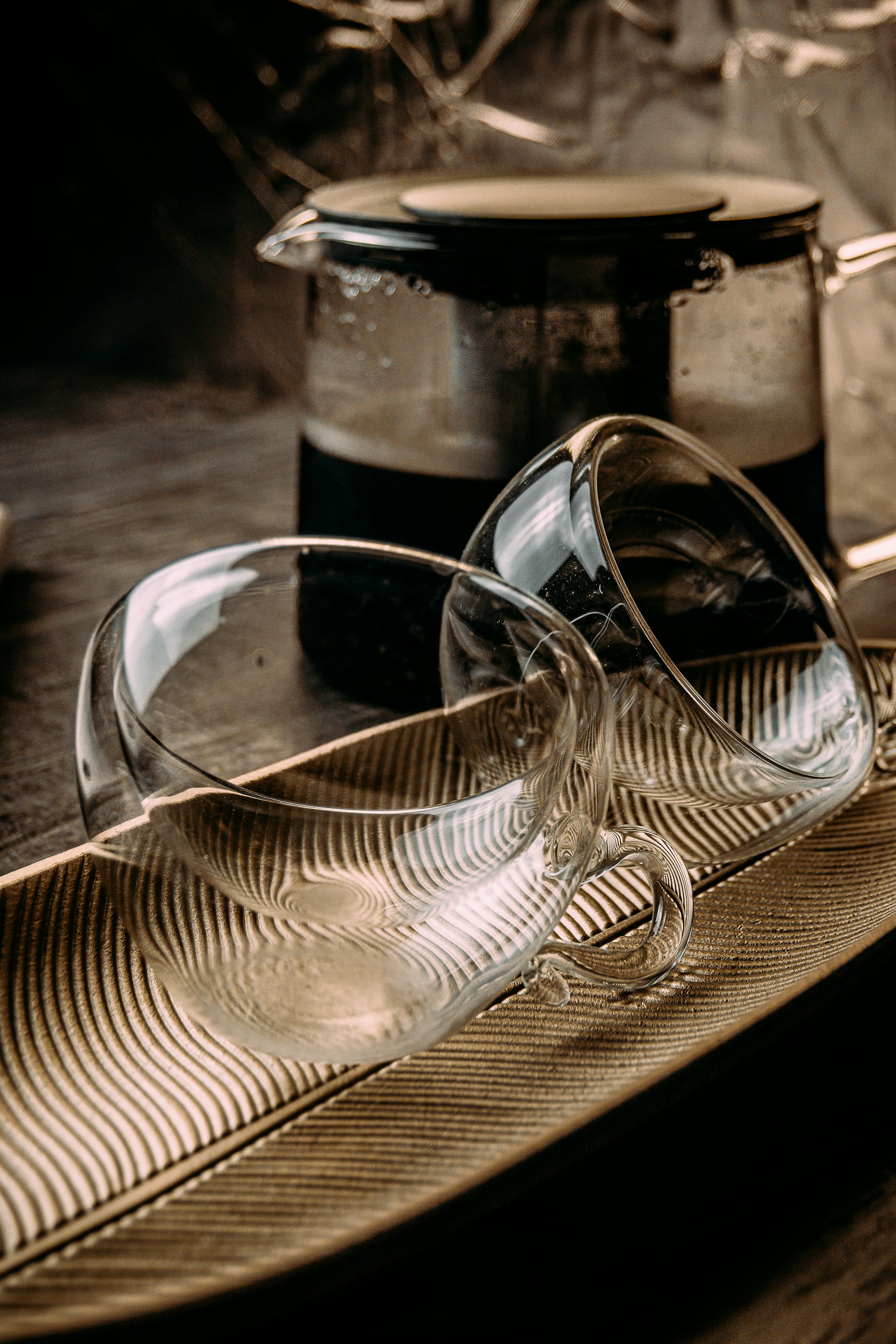 clear glass cup on brown wooden table