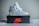 a pair of sneakers sitting on top of a box