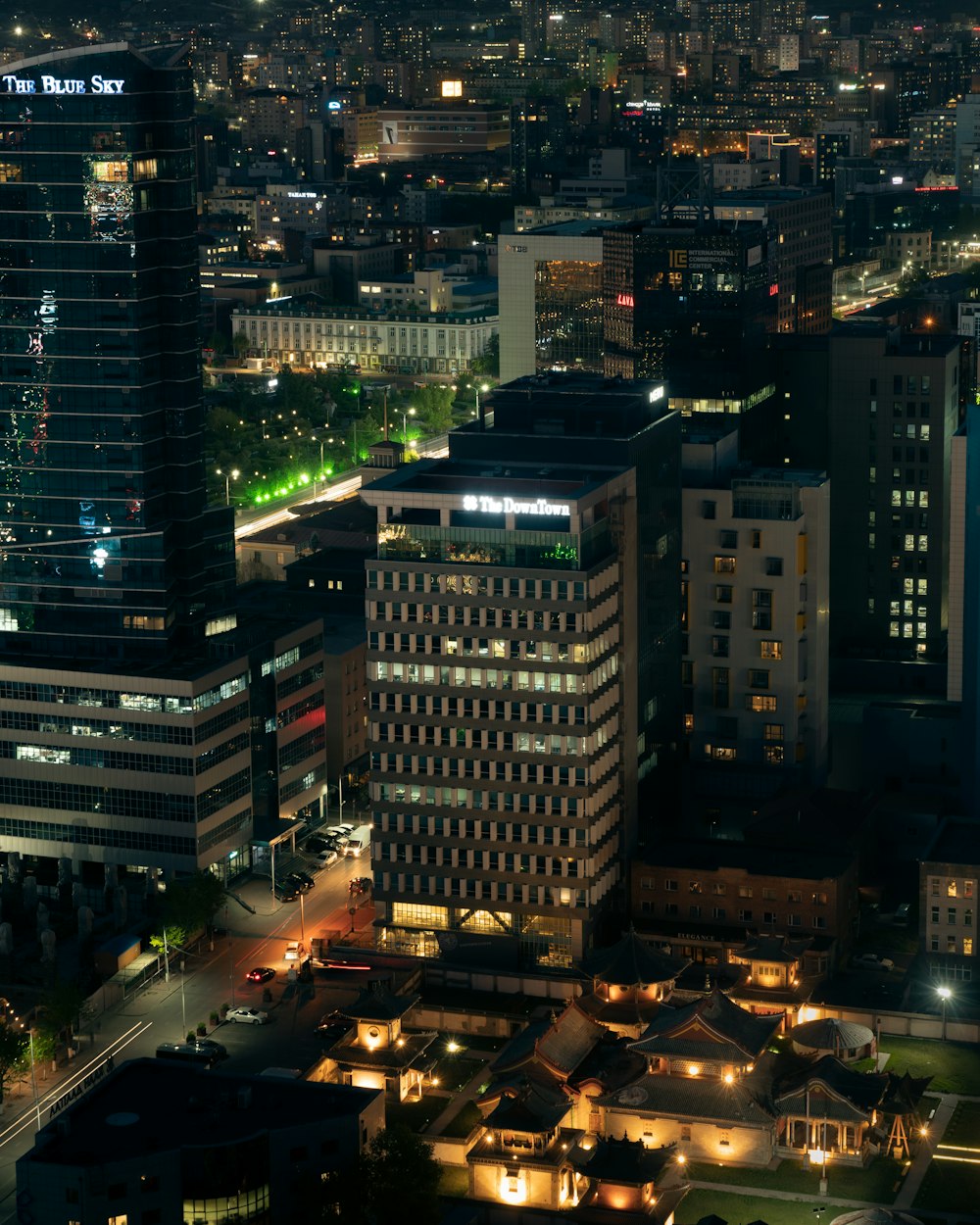 a view of a city at night from the top of a building