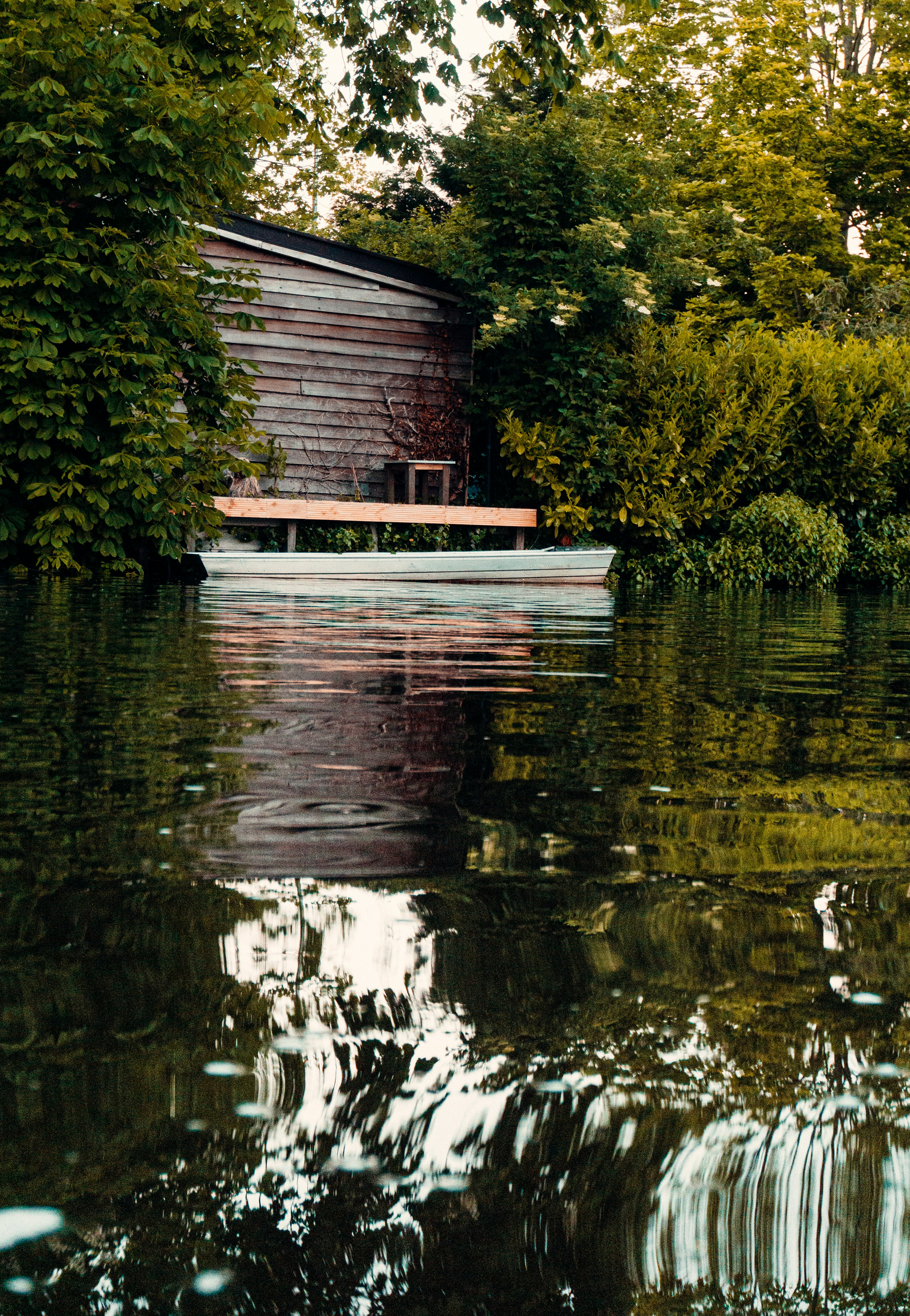 Brown wooden house on body of water during daytime photo – Free ...