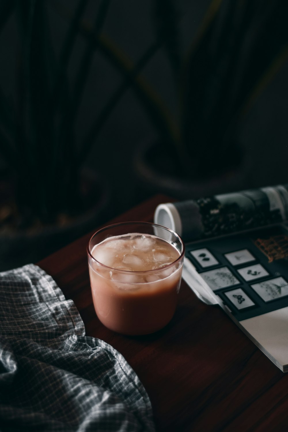 clear glass cup with brown liquid