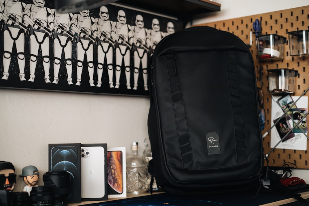 black and gray speaker on brown wooden table