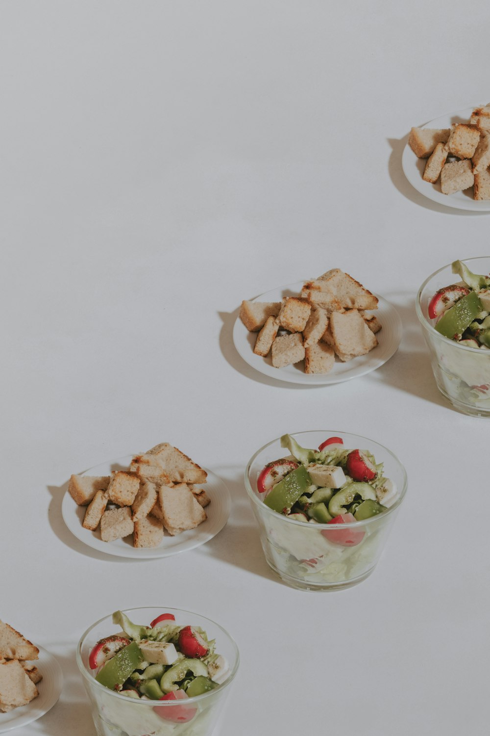 a number of small bowls of food on a table