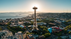 a view of a city with a tower in the middle of it