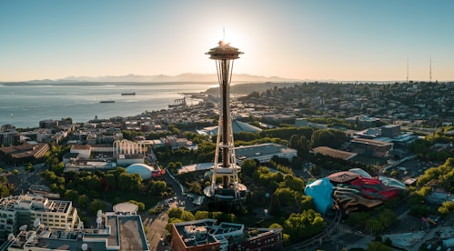 a view of a city with a tower in the middle of it